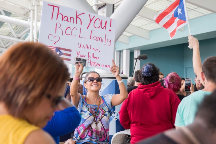 Family and friends welcome evacuees from islands affected by Hurricane Maria on Tuesday, Oct. 3, 2017 in Fort Lauderdale, Fla. They arrived to Port Everglades on board Royal Caribbean International's Adventure of the Seas following a humanitarian relief trip to Puerto Rico, St. Croix and St. Thomas. (Jesus Aranguren/AP Images for Royal Caribbean)