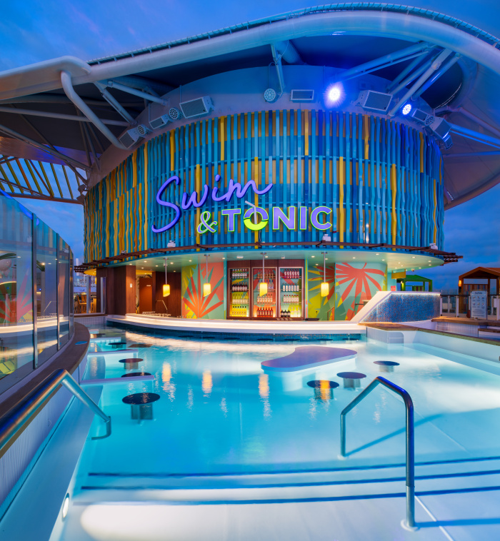 On Icon of the Seas, Swim & Tonic in Chill Island is Royal Caribbean's first swim-up bar at sea. Vacationers can have a sip while they take a dip and sit back at this vibrant spot, with in-water loungers and tables, a whirlpool and more.