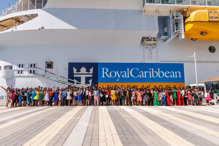 May 2024 – Students and supporters of Junior Achievement (JA) New Providence pose alongside Symphony of the Seas on Saturday, May 11, before celebrating the 2023-2024 JA New Providence top achievers on board.