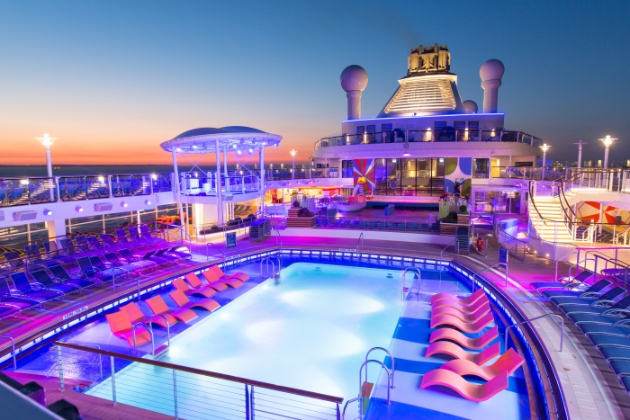 Royal Caribbean introduces its newest and most technologically advanced cruise ship Anthem of the Seas. Pool Bar at sunsetCredit SBW-Photo