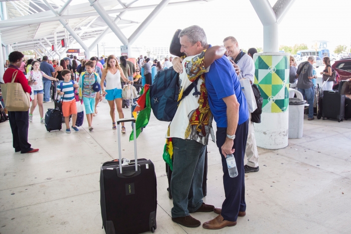 Royal Caribbean International President and CEO Michael Bayley greets a Hurricane Maria evacuee on board Adventure of Seas on Tuesday, Oct. 3, 2017 in Fort Lauderdale, Fla. The cruise line worked with local governments in Puerto Rico, St. Croix and St. Thomas to facilitate the evacuation of approximately 3,400 people and coordinate the delivery of emergency supplies. (Jesus Aranguren/AP Images for Royal Caribbean)
