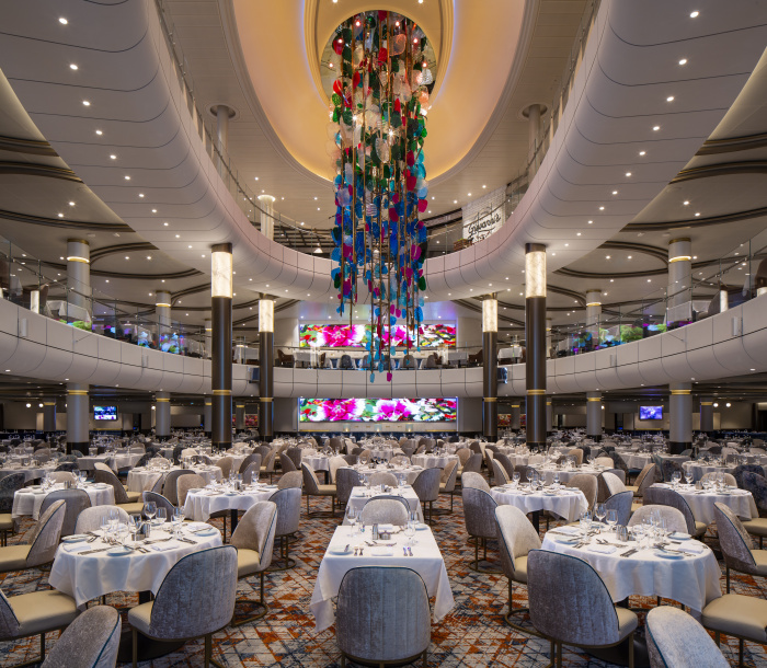 The three-level main dining room on board Odyssey of the Seas.