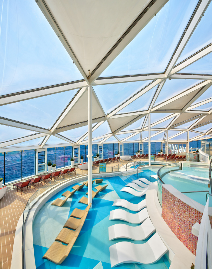 The Solarium is a fully climatized adults-only escape on board Wonder of the Seas that features pools, whirlpools, in-pool loungers, nooks, sun loungers and more ways for quality relaxation time.