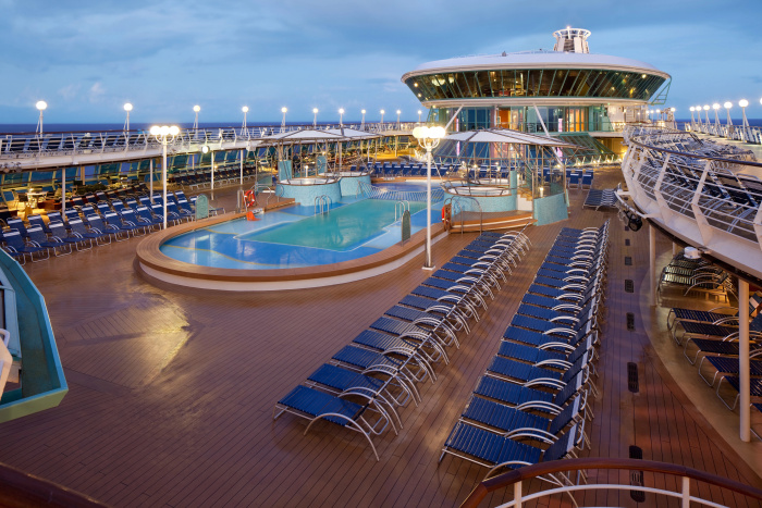 Royal Caribbean’s Rhapsody of the Seas features indoor and outdoor pools, where vacationers can kick back and soak in the views and vibes.