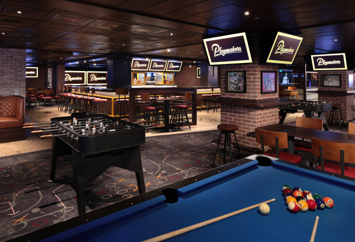 With a menu of game day bar bites and ice-cold beers, the popular Playmakers Sports Bar & Arcade makes its way to the lively Royal Promenade on Icon of the Seas. The staple is the ultimate hangout for adventurers to catch their home team on dozens of screens and to challenge each other in some friendly competition at the arcade and more.