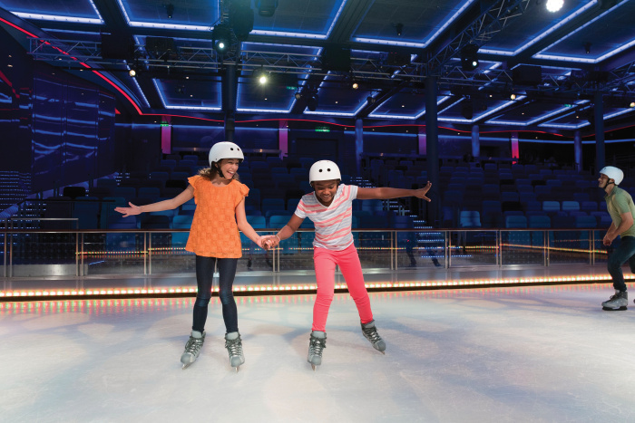 The Studio B ice-skating rink is a signature Royal Caribbean venue, where professional ice skaters perform awe-inspiring feats by night and vacationers can have a spin with friends and family by day. 